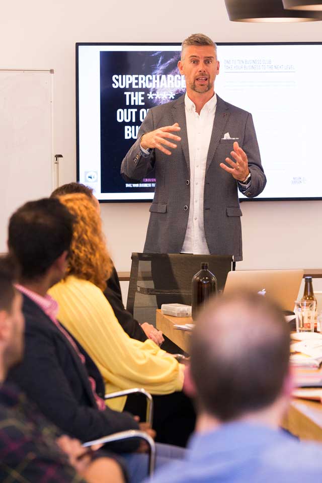 Mark Dobson presenting to room of business people