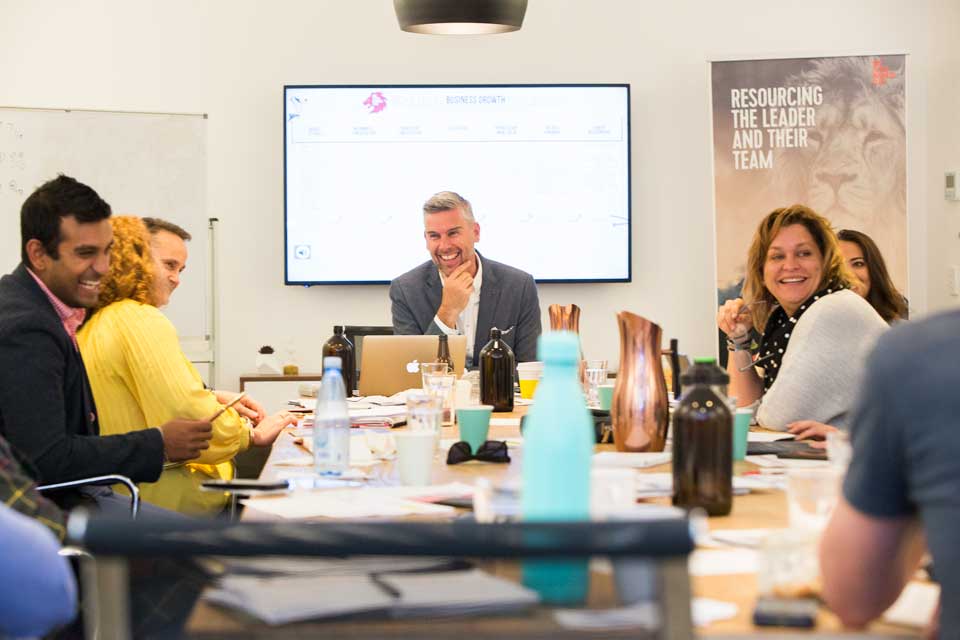 Mark Dobson presenting to room of business people