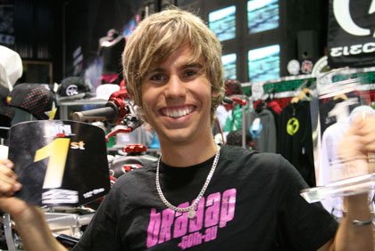 Brad Smith wearing braaap T-shirt holding gold 1st award