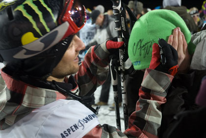 Skier Colby James West signing a fan's beanie at the XGames