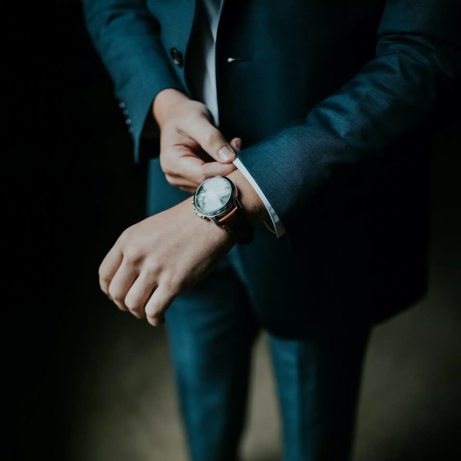 Business man in suit with wrist watch
